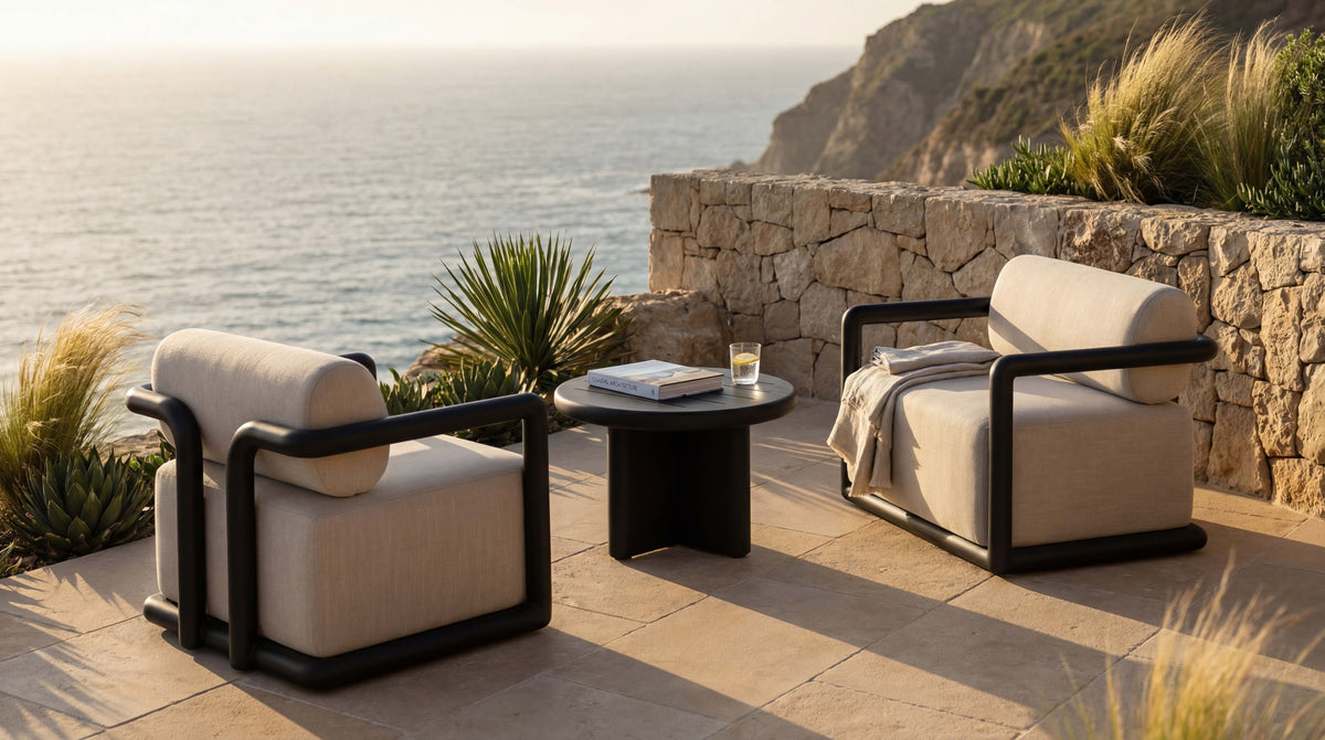 Amy Ann Living outdoor living room with a deep sofa and lounge chairs opening onto the garden